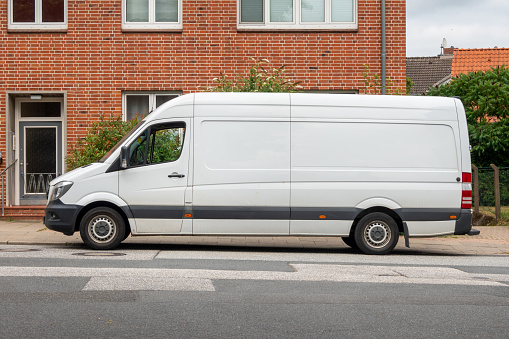 Delivering the packages with a white van in the village