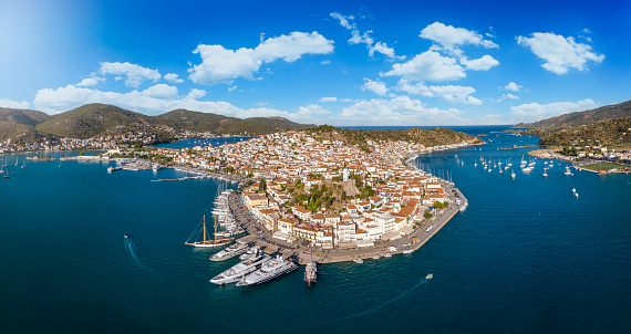 Panoramic aerial view of the town and harbour of Poros island, Saronic Gulf, Greece, during a sunny summer day