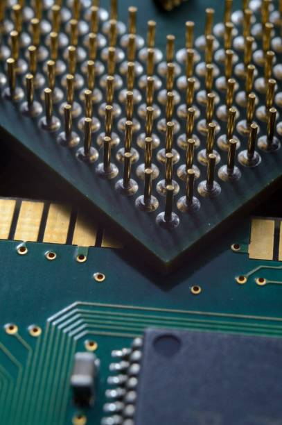 istock microprocessor on the background of the microcircuit of the motherboard. 1410325439