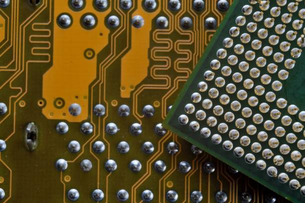 istock microprocessor on the background of the microcircuit of the motherboard. 1410325583