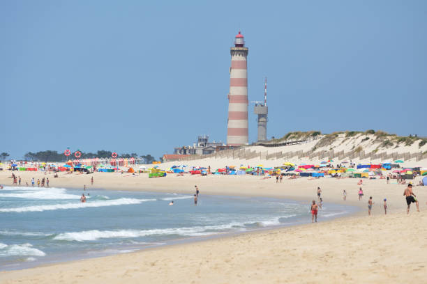 Lighthouse in Aveiro, Portugal Situated on the coastal Praia da Barra, at the southern margin of the Ria de Aveiro, it is the tallest lighthouse in Portugal braga portugal stock pictures, royalty-free photos & images
