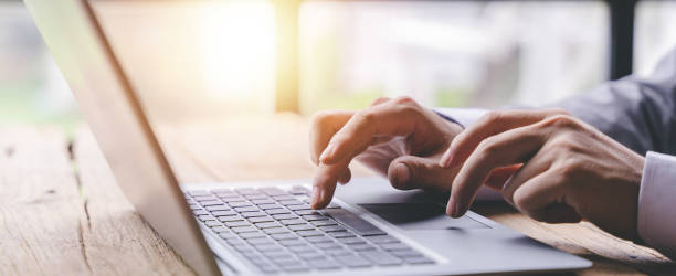 istock Typing on a tablet computer in a modern office. Make an account analysis report. real estate investment information financial and tax system concepts 1410329004