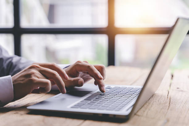 istock Typing on a tablet computer in a modern office. Make an account analysis report. real estate investment information financial and tax system concepts 1410329005