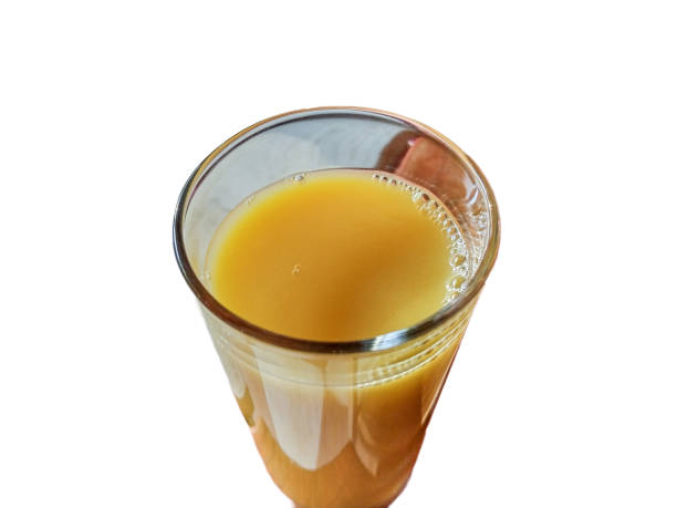 istock orange juice in a glass isolated on white background 1410337646