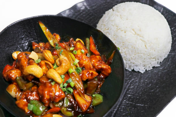 chinese style kung pao chicken and vegetables with scented steamed jasmine rice chinese style kung pao chicken and vegetables with scented steamed jasmine rice CASHEWS stock pictures, royalty-free photos & images