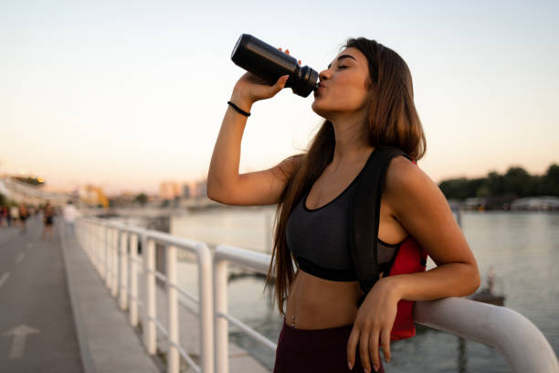 istock Attractive female athlete taking a short break from training 1410339709