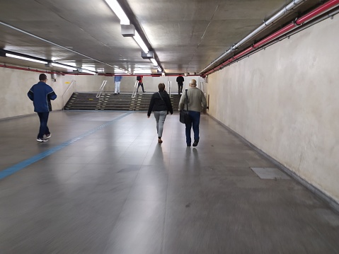 People walking by the tunnels of Se subway station in Sao Paulo city, SP, Brazil.