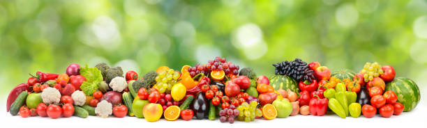 istock Bright multi-colored berries, fruits and vegetables on green 1410343293