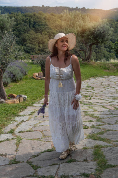 istock Lady in white summer dress 1410347885