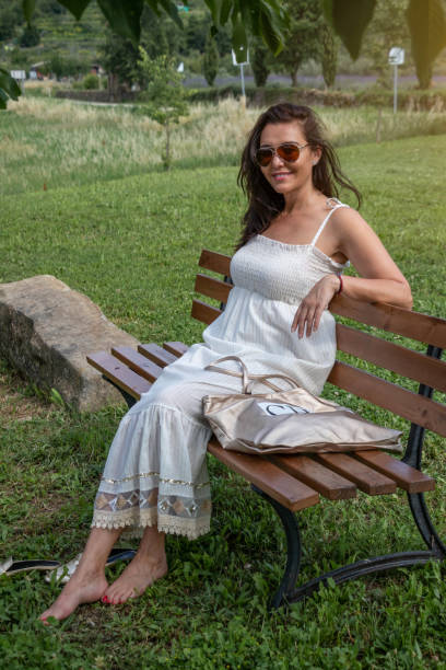 istock Sitting on a bench, enjoying the day 1410347893