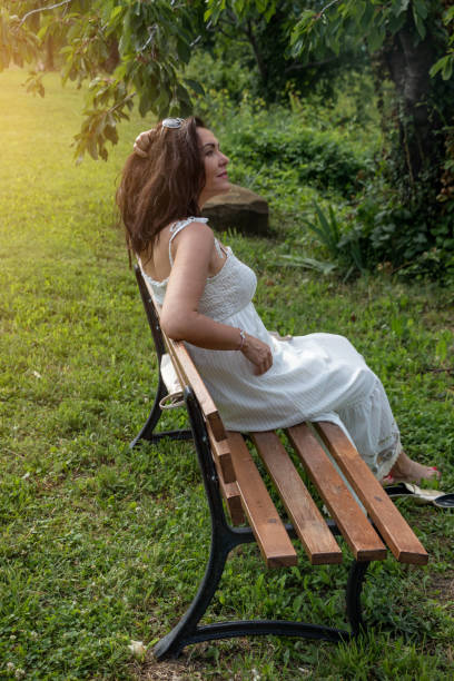 istock Attractive brunette lost in thoughts 1410347894
