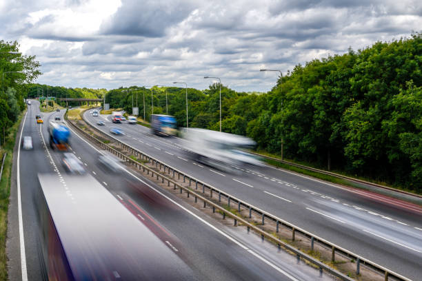 istock Cars driving on a motorway with motion blur from long exposure 1410347962