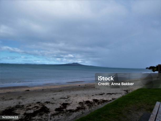 Rain Clouds On The Move At The Milford Beach Auckland Stock Photo - Download Image Now