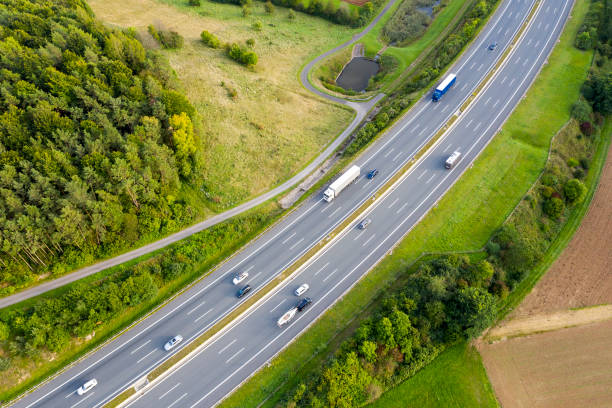istock Highway with Trucks in Rural Area, Aerial View 1410351610