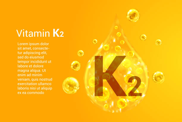 ビタミンk2。酸素泡のある金色の滴のベクター画像を持つバナー。健康の概念。 - vitamin k illustrations点のイラスト素材／クリップアート素材／マンガ素材／アイコン素材