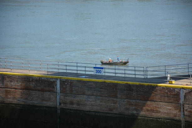 Gallatin County, Kentucky, 2022:  A fishing boat sits on still waters at Markland Lock and Dam on the Ohio River.