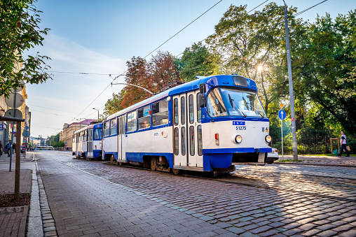 Riga, Latvia - August 7, 2019: View on old colorful buildings and streets of Riga, modern tram, Latvia. Architecture in Riga city center