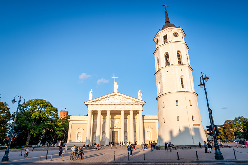 Vilnius, Lithuania - August 9, 2019: tourists in front The Cathedral and belfry tower in Vilnius