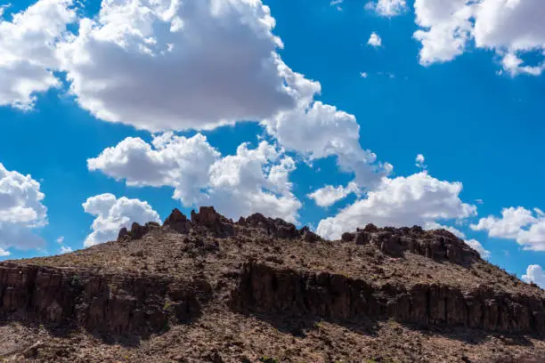 Clouds float over an arid butte outside Kingman, Arizona.