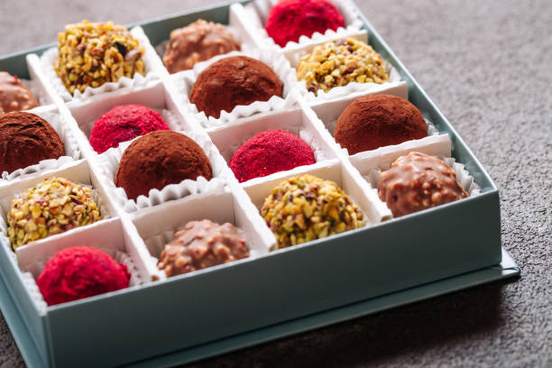 istock A set of truffle sweets with different fillings on a brown background 1410358640