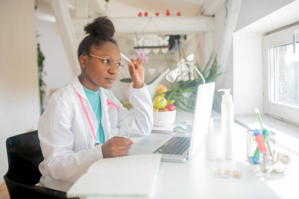 istock Female doctor making video call 1410361656