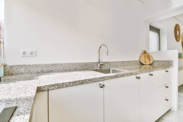istock Spacious kitchen with marble floor and modern furniture 1410362476