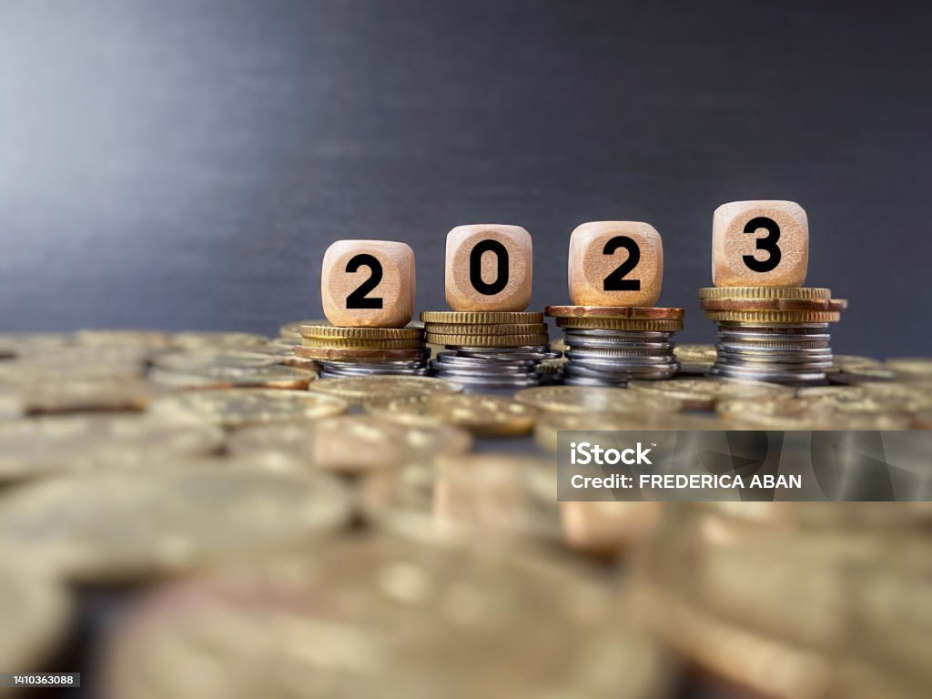 Business Concept Finance and Economy of New Year Concept. 2023 text on wooden blocks in vintage background. 2023 Stock Photo