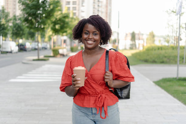 istock Young girl holding a coffee cup 1410365127