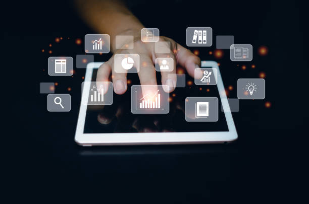 istock Business man use tablet for big data analysis and business intelligence marketing planning concept virtual screen. 1410367108