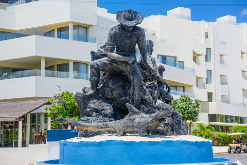 Monument of a fisherman, Al Pescador y Su Familia, Isla Mujeres island, Caribbean Sea, Cancun, Yucatan, Mexico.