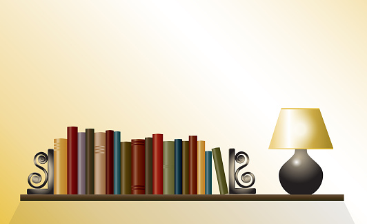 A bookshelf of books between bookends with table lamp. Space for your text. Also available in vector format.