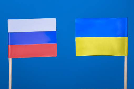 Russian and Ukrainian flags with blue background