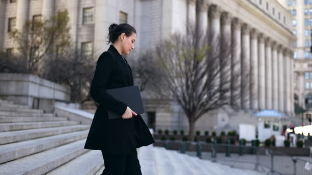 Female lawyer leaving courthouse