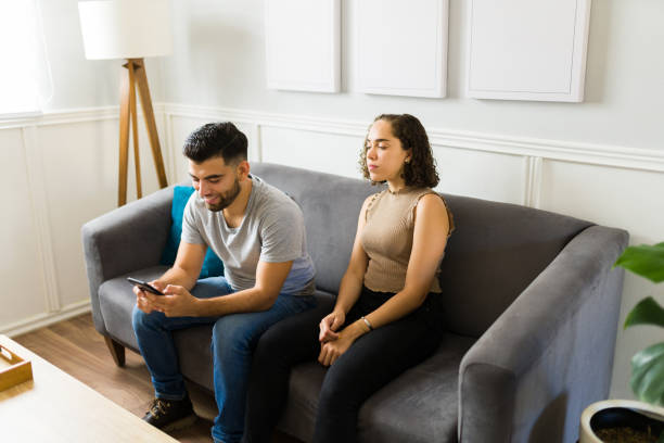 istock Young man lying to his girlfriend and texting on the smartphone 1410385543