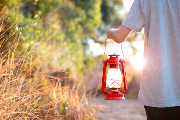 istock Carrying a kerosene lamp 1410386350