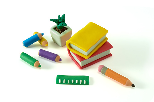 Plasticine school objects set with education symbols isolated on a white background. Back to school. Set of Clay plasticine handmade school icons. School supplies made of plasticine. 3d artwork