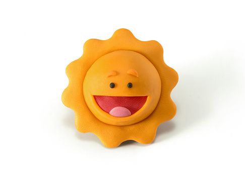 Plasticine sun isolated on a white background. Cartoon sun from plasticine or clay. The concept of children's creativity or sunny weather. 3d artwork