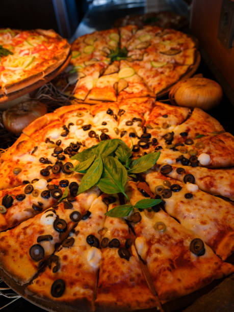 istock fresh italian pizzas in a restaurant 1410388250