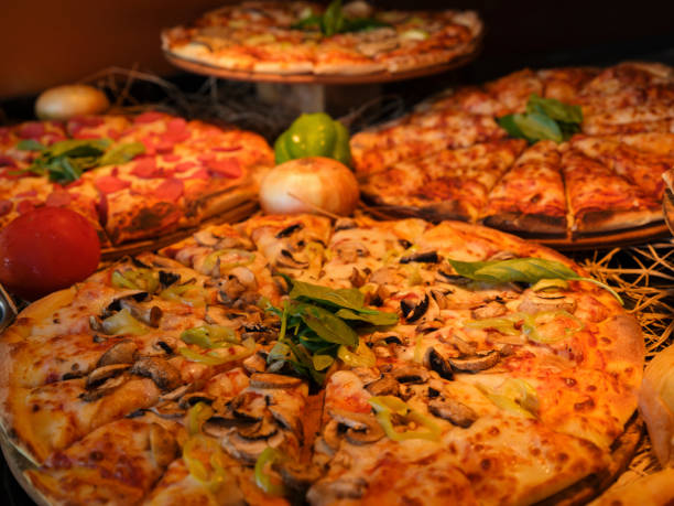 istock fresh italian pizzas in a restaurant 1410388324