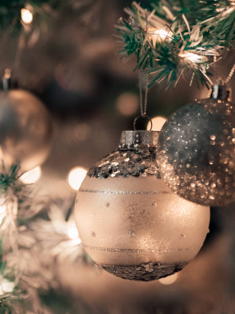 istock Christmas tree ornaments jingles bokeh warm bling 1410390069
