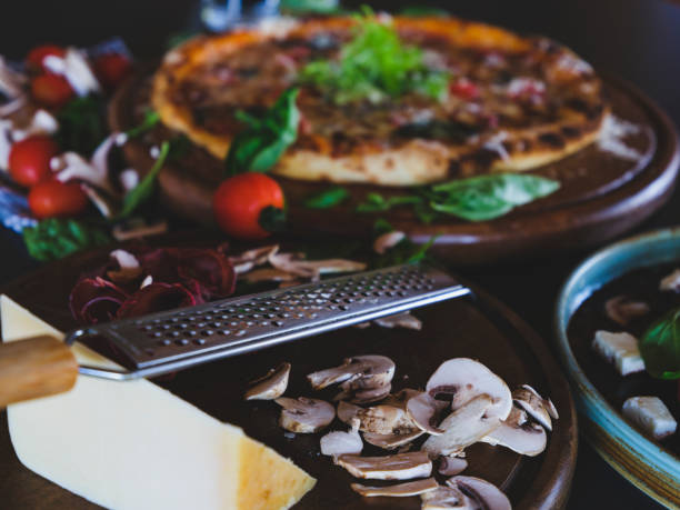 a fresh italian pizza and vegetables on the table
