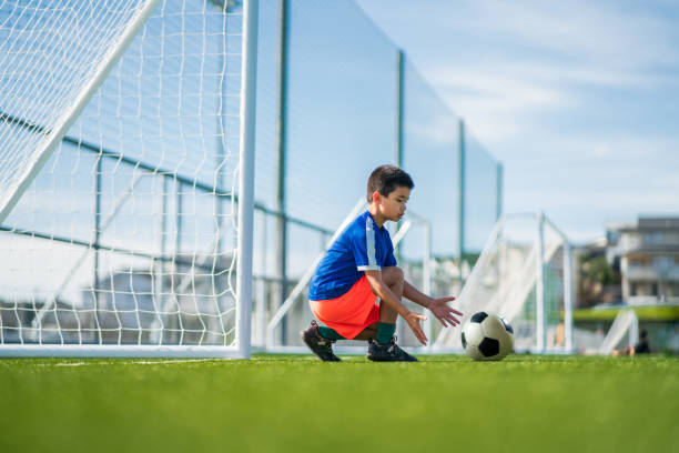 istock Mixed race kid during football training. 1410390532