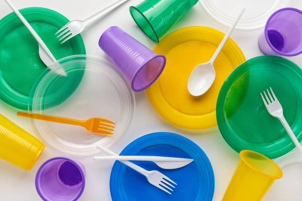 istock A set of a variety of disposable plastic tableware utensils. 1410392205