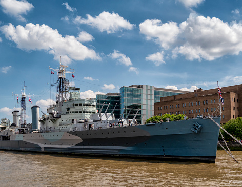 The former warship HMS Belfast moored near Tower Bridge in London: it is now part of the Imperial War Museum.