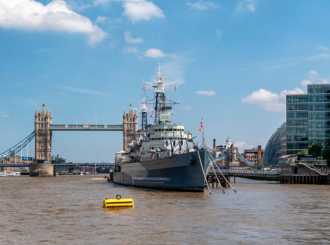Museum ship HMS Belfast (right) and the Brazilian training ship Brasil (U27) in their berth at the Pool of London in London, United Kingdom. The famous Tower Bridge is rising in the background. September 2nd 2011