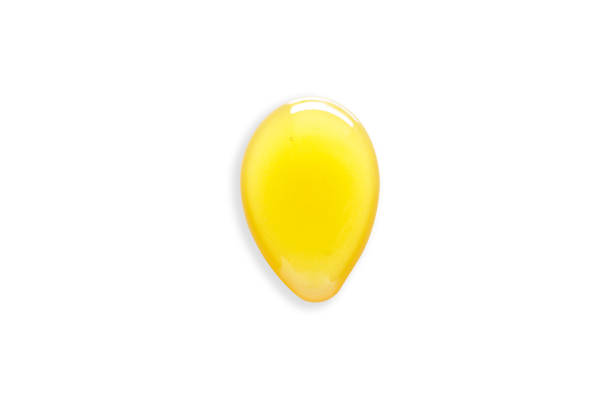 istock Honey drop isolated on white.File contains clipping path. 1410395602