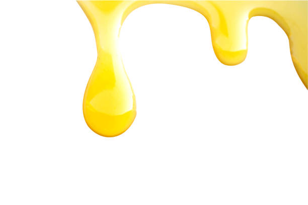 istock Sweet honey flowing isolated on white.File contains clipping path. 1410395613