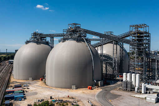 Large industrial biofuel storage tanks or containers at a coal fired power station