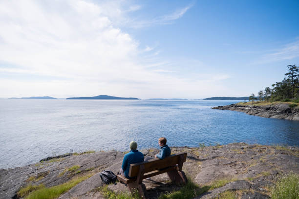 istock Couple enjoy the views over the ocean 1410399116