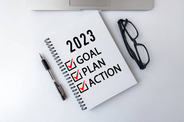 istock 2023 Goal, Plan, Action checklist text on note pad with laptop, glasses and pen. 1410400164